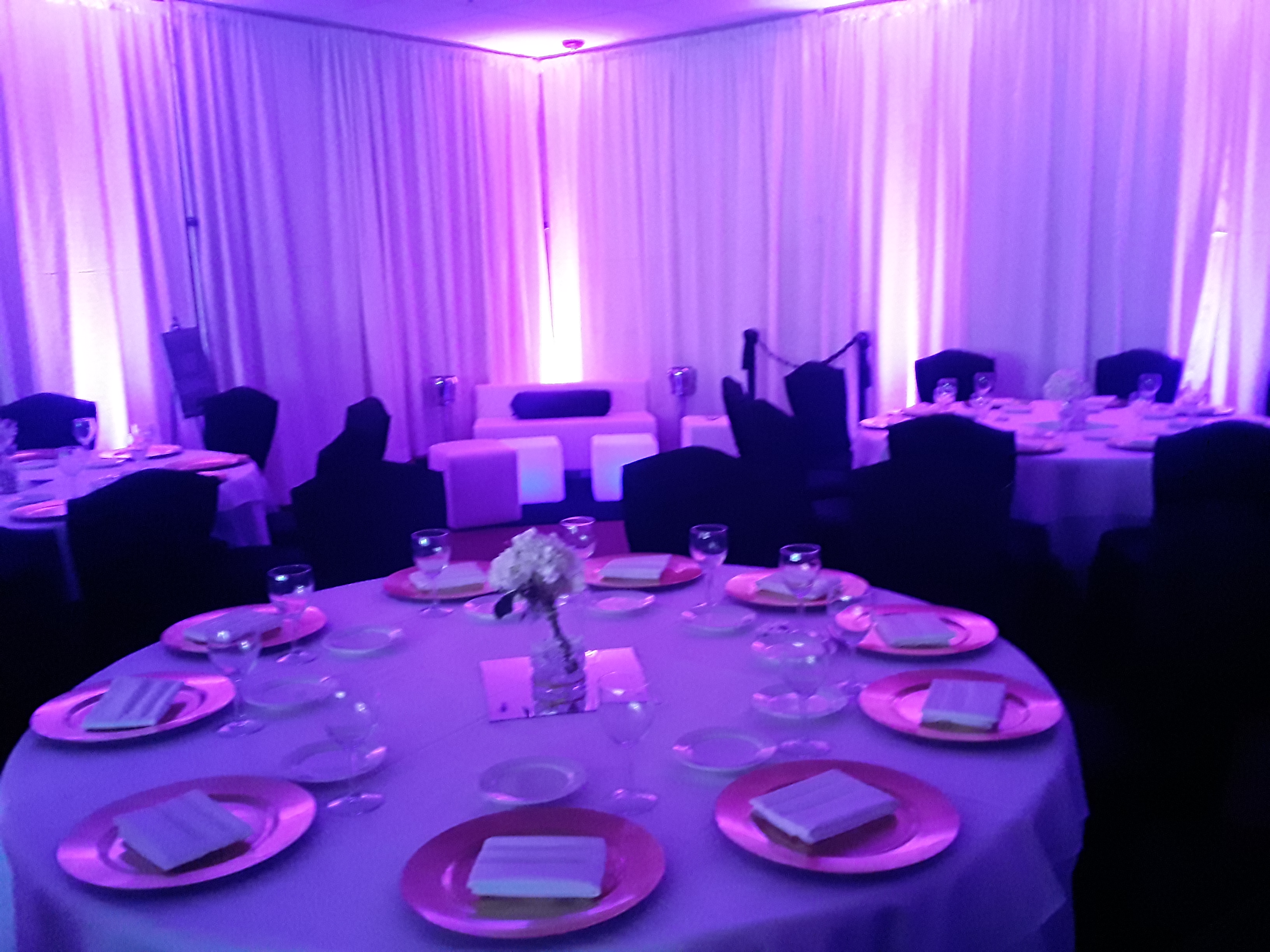 Magenta LED uplights for event walls